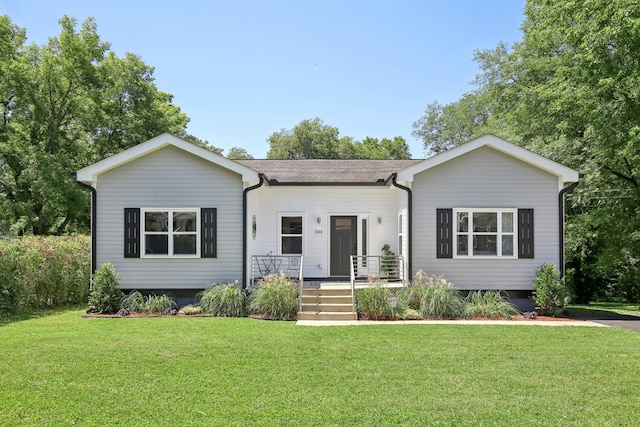 view of front of house with covered porch and a front yard