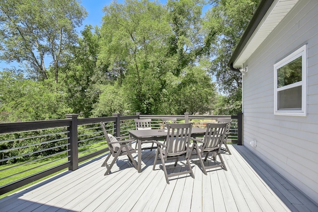 wooden deck with outdoor dining space