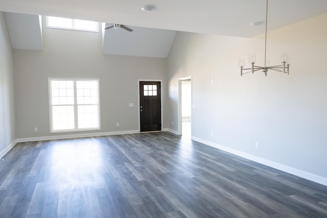 foyer with high vaulted ceiling, dark wood finished floors, a ceiling fan, and baseboards