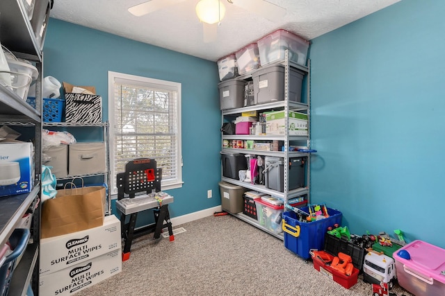 storage area featuring ceiling fan