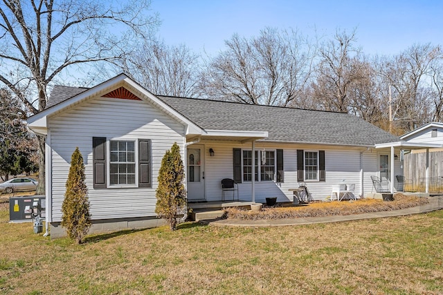 single story home with a shingled roof and a front lawn