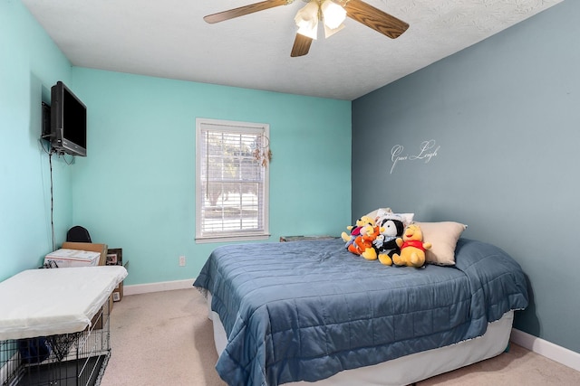 bedroom featuring a ceiling fan, carpet flooring, and baseboards