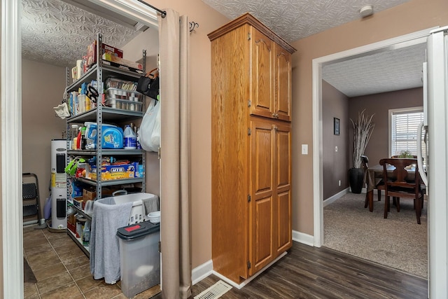 pantry featuring electric water heater