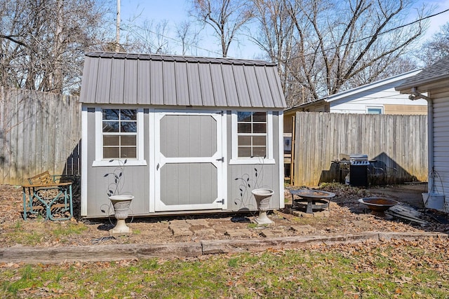 view of shed featuring fence