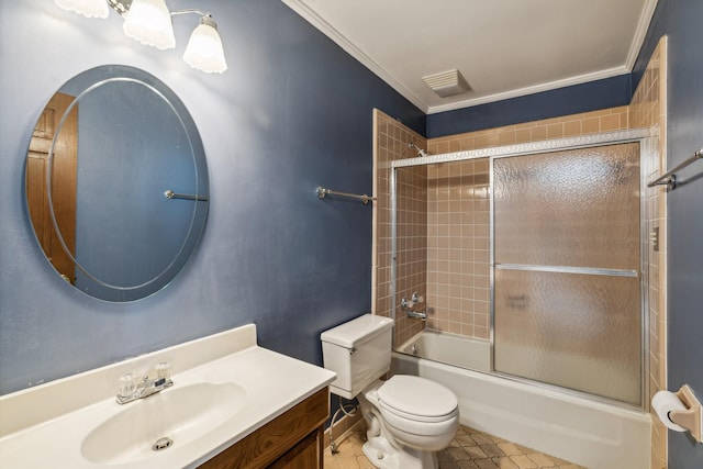 full bathroom featuring visible vents, bath / shower combo with glass door, toilet, ornamental molding, and vanity