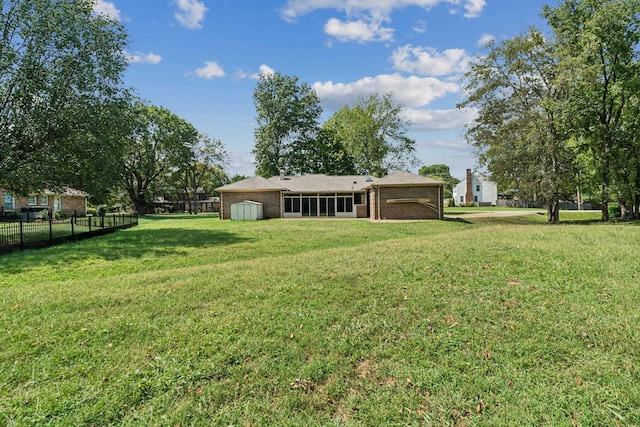 view of yard featuring a garage and fence