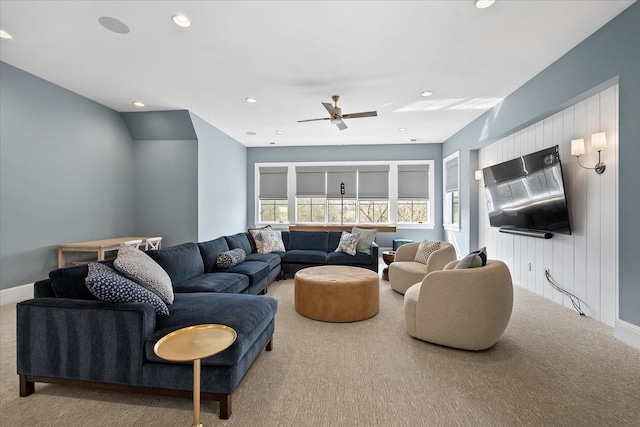 carpeted living room with ceiling fan, baseboards, and recessed lighting