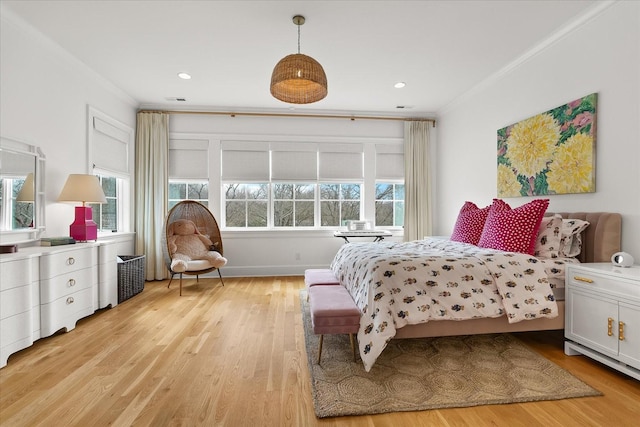 bedroom with ornamental molding, recessed lighting, visible vents, and light wood-style floors