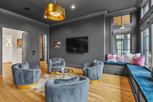 living room with baseboards, recessed lighting, wood finished floors, and crown molding