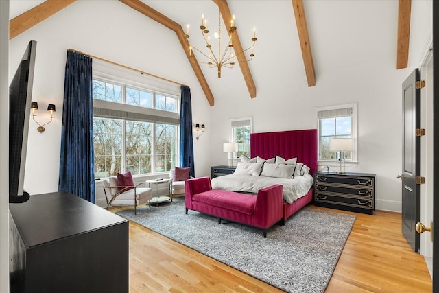 bedroom with high vaulted ceiling, light wood-style flooring, a notable chandelier, baseboards, and beamed ceiling