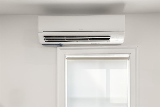 interior details with a wall mounted AC