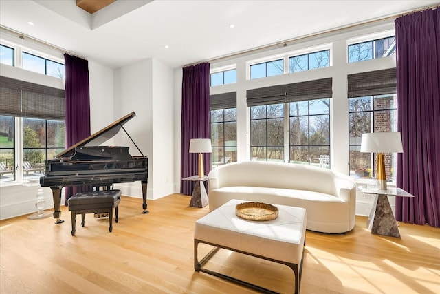 sitting room featuring baseboards and wood finished floors