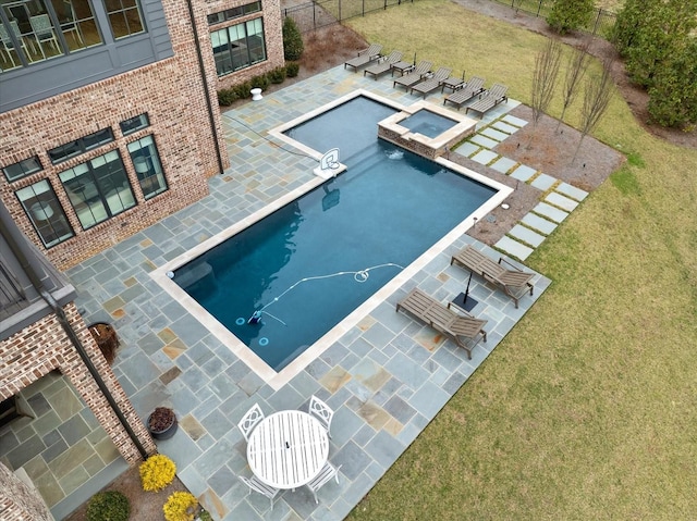 view of pool with a yard, a patio, and fence