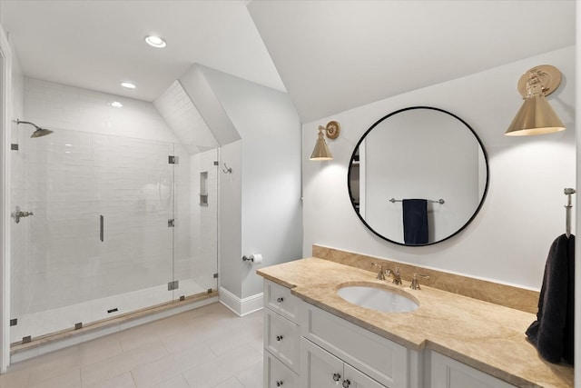 full bath with baseboards, vaulted ceiling, vanity, a shower stall, and recessed lighting