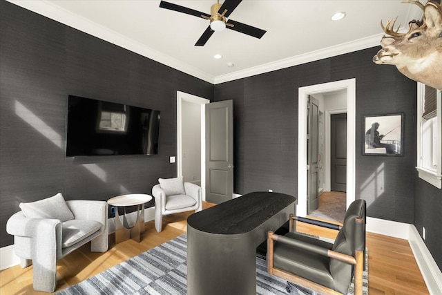 living area featuring baseboards, crown molding, recessed lighting, and light wood-style floors