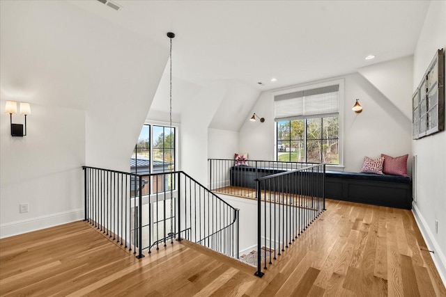 bonus room with baseboards, vaulted ceiling, wood finished floors, and recessed lighting