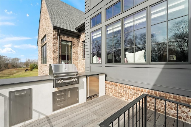 wooden deck with grilling area and area for grilling