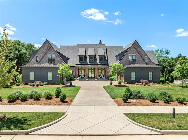 9289 Fordham Dr, Brentwood, TN 37027 - view of front of house with a front yard and a chimney