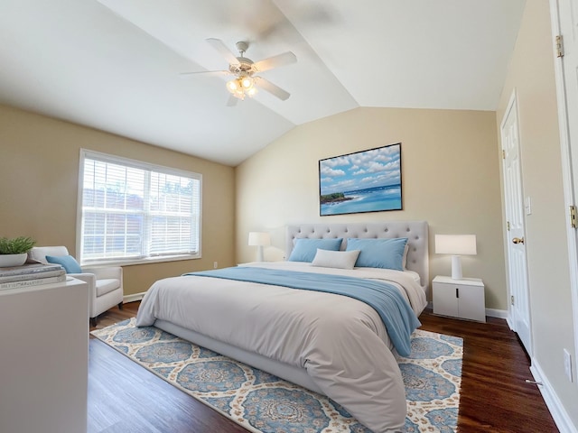 bedroom with vaulted ceiling, ceiling fan, wood finished floors, and baseboards