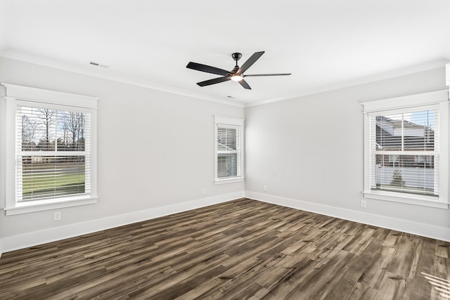 unfurnished room featuring baseboards, visible vents, dark wood-style floors, ceiling fan, and crown molding