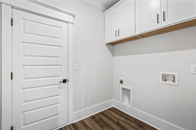 washroom featuring dark wood-style floors, hookup for a washing machine, cabinet space, electric dryer hookup, and baseboards