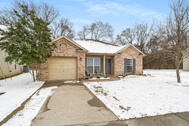 single story home featuring an attached garage, driveway, central AC unit, and brick siding