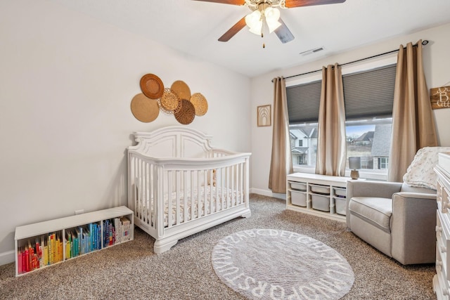 bedroom with visible vents, baseboards, ceiling fan, carpet, and a nursery area