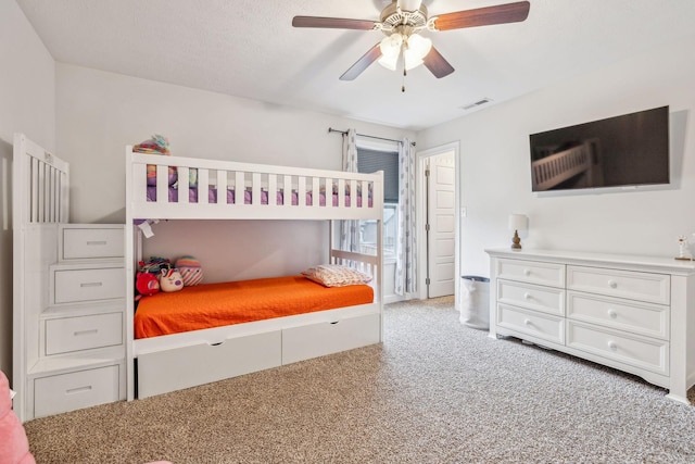 bedroom featuring ceiling fan, carpet flooring, and visible vents