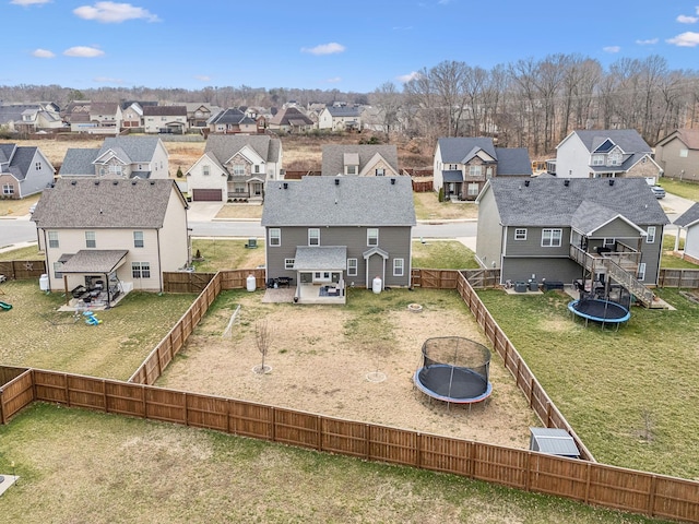 birds eye view of property with a residential view