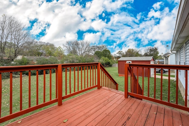 wooden deck featuring a lawn