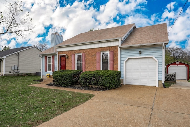 view of front of house featuring concrete driveway, a chimney, roof with shingles, a front lawn, and brick siding