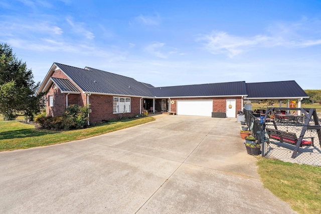 ranch-style home featuring a garage, metal roof, brick siding, and fence