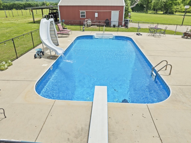 181 Hickory Grove Rd, Huntland, TN 37345 - view of swimming pool featuring a water slide, a diving board, and a patio