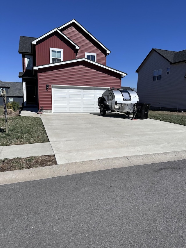 view of front of home featuring a garage, driveway, and board and batten siding