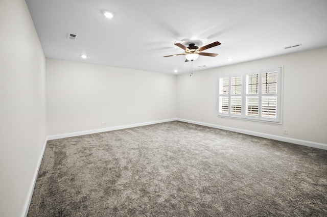 carpeted spare room featuring a ceiling fan, recessed lighting, visible vents, and baseboards