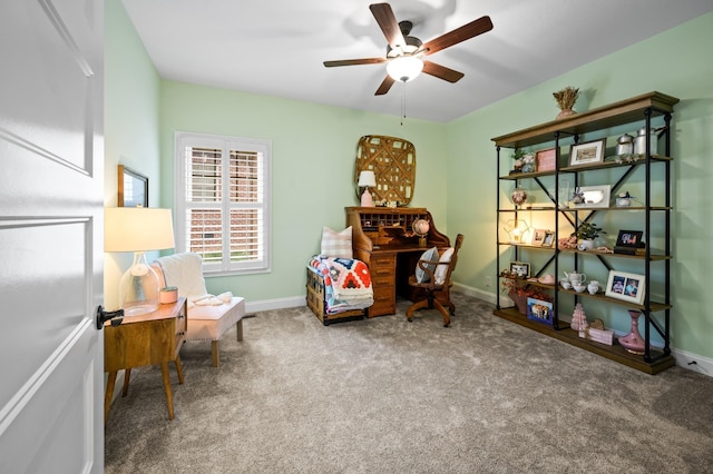 sitting room with carpet, ceiling fan, and baseboards