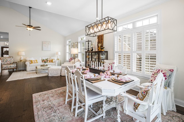 dining area with high vaulted ceiling, baseboards, a ceiling fan, and wood finished floors