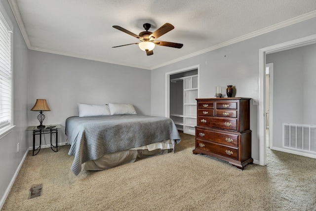 bedroom with carpet, visible vents, and a closet