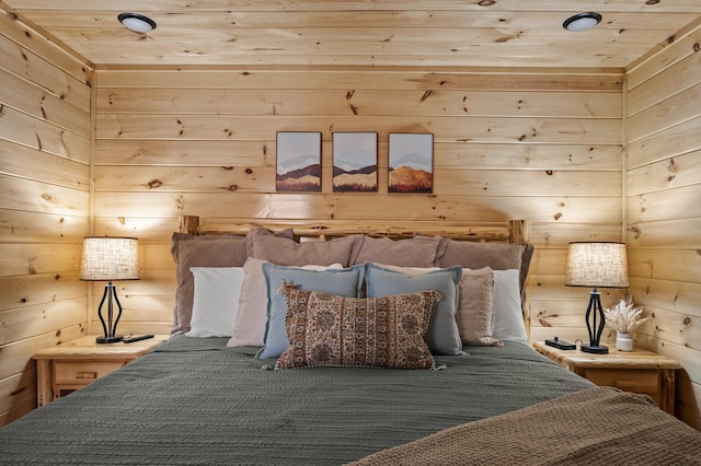 bedroom featuring wooden ceiling and wood walls