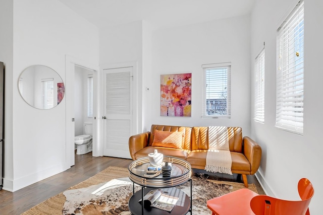 living room with wood finished floors and baseboards