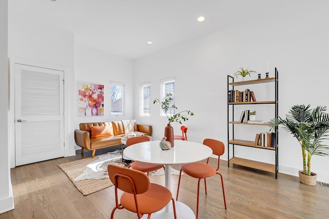 sitting room with wood finished floors and recessed lighting