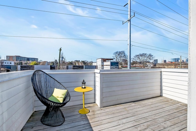 wooden deck with a view of city