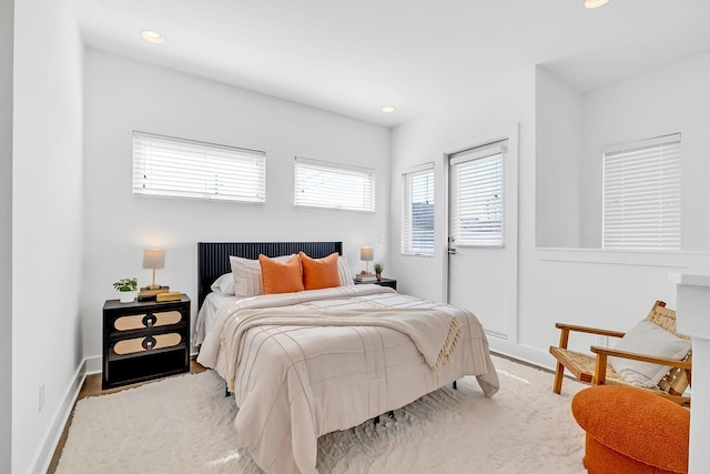 bedroom featuring recessed lighting and baseboards