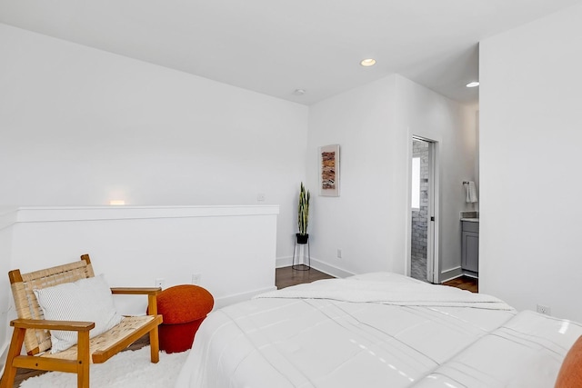 bedroom featuring recessed lighting, connected bathroom, and baseboards