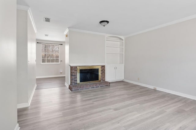 unfurnished living room with baseboards, a fireplace, visible vents, and ornamental molding