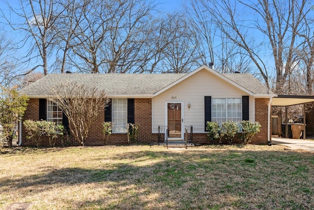 ranch-style home with a carport, a front yard, brick siding, and driveway