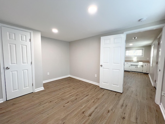 interior space with recessed lighting, light wood-type flooring, and baseboards