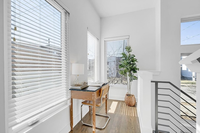 office with baseboards and wood finished floors