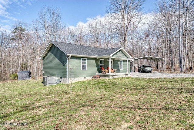 view of front of house with a carport, a front lawn, crawl space, and a porch