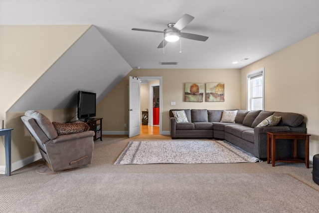 living room featuring carpet floors, baseboards, visible vents, and a ceiling fan